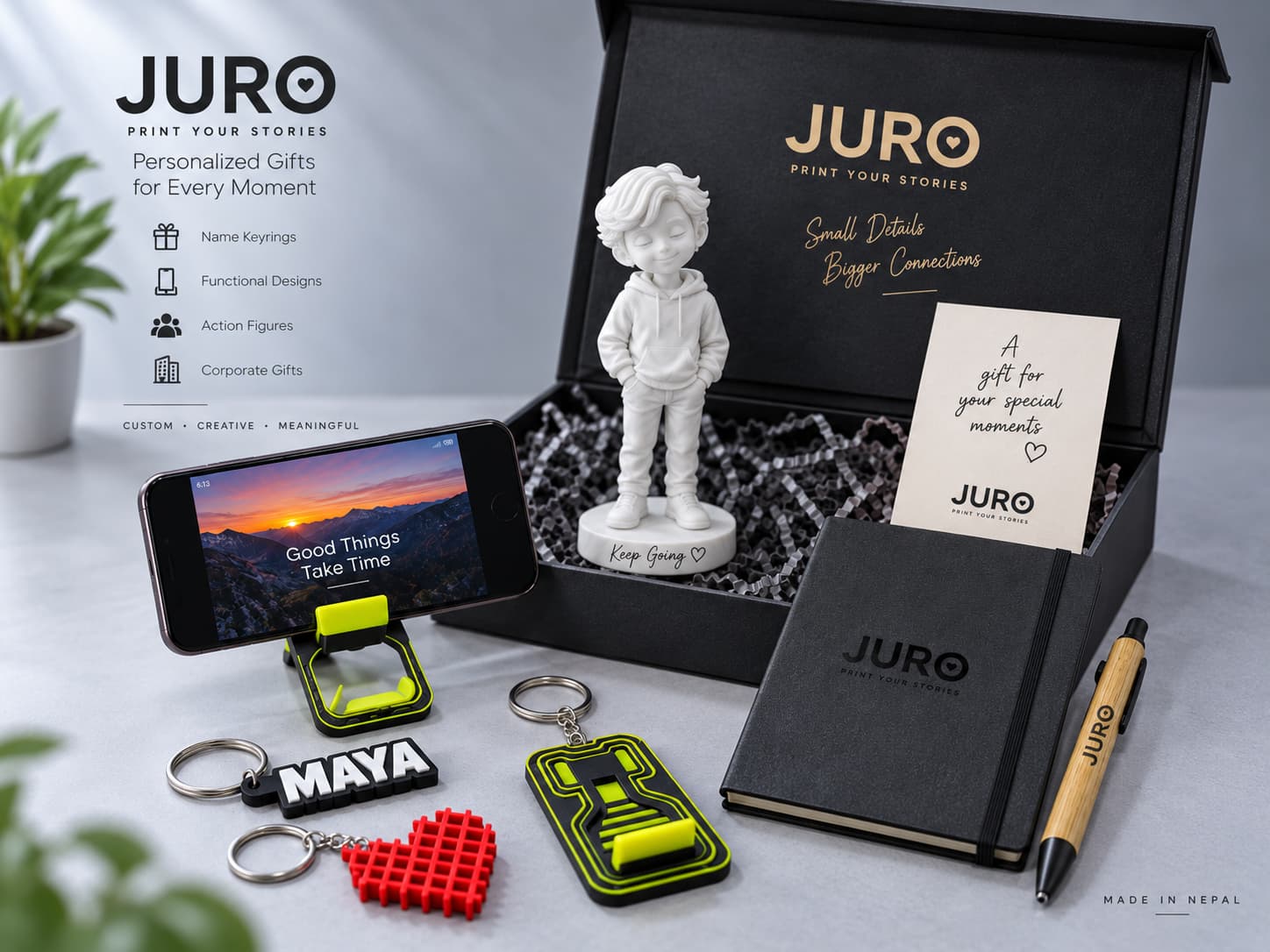 A JURO corporate gift kit with a custom figure, notebook, pen, and keyrings